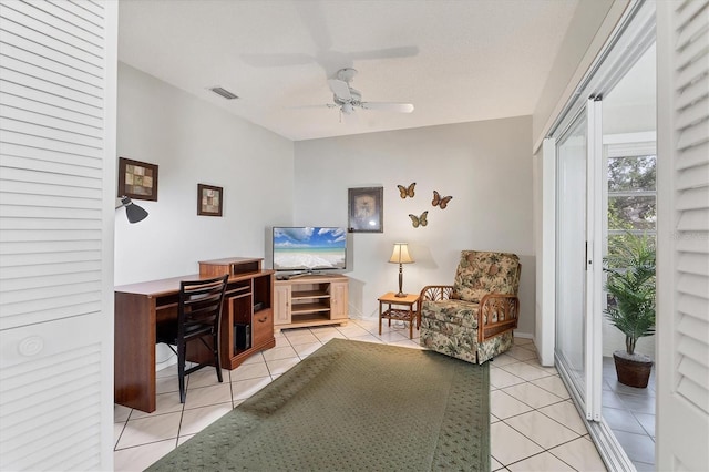 home office with ceiling fan and light tile patterned flooring