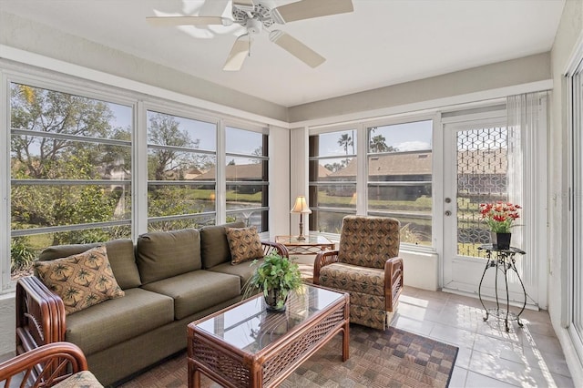 sunroom featuring ceiling fan