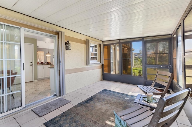 sunroom / solarium featuring wood ceiling