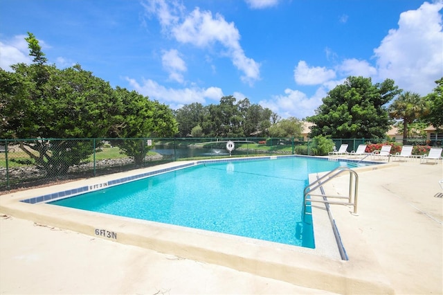 view of swimming pool featuring a patio