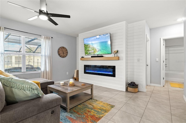 living room featuring light tile patterned flooring and ceiling fan