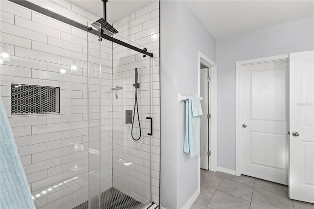 bathroom featuring an enclosed shower and tile patterned flooring