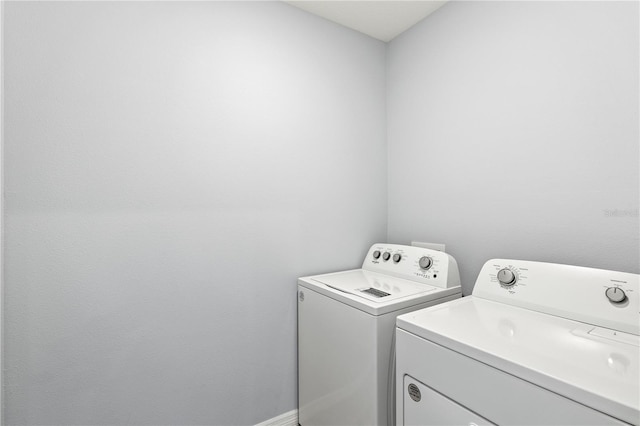 washroom featuring separate washer and dryer