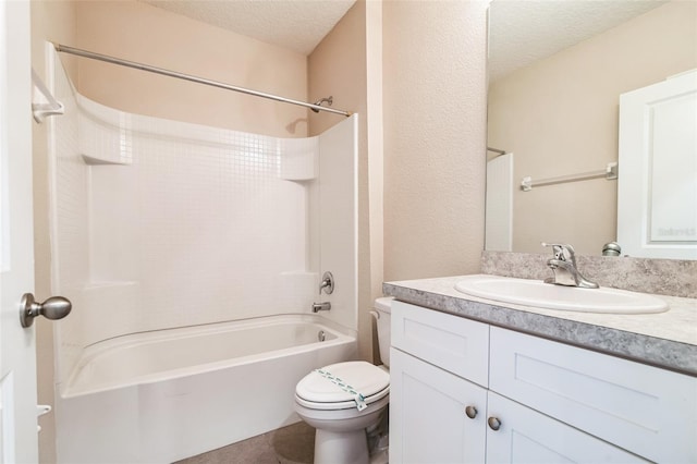 bathroom featuring bathtub / shower combination, toilet, a textured ceiling, vanity, and tile patterned floors