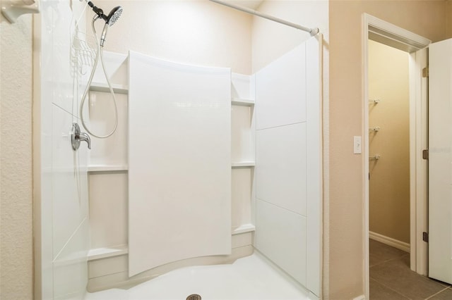 bathroom featuring a stall shower and tile patterned floors