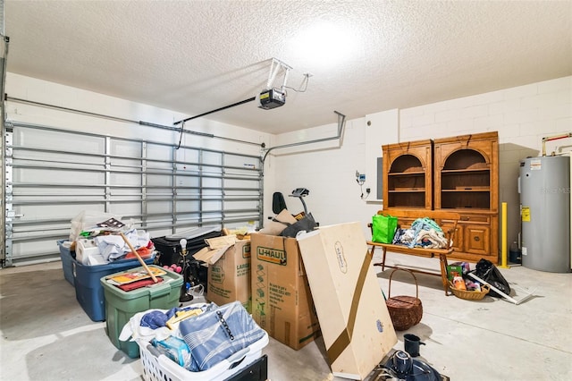 garage with concrete block wall, water heater, and a garage door opener