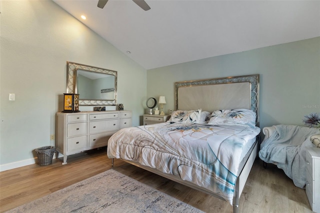 bedroom featuring lofted ceiling, light hardwood / wood-style flooring, and ceiling fan