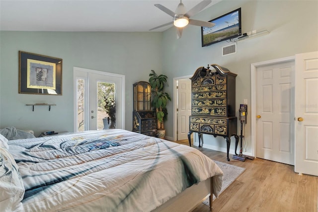 bedroom with ceiling fan, high vaulted ceiling, access to exterior, and light hardwood / wood-style floors