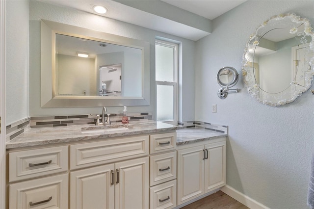 bathroom featuring vanity and wood-type flooring