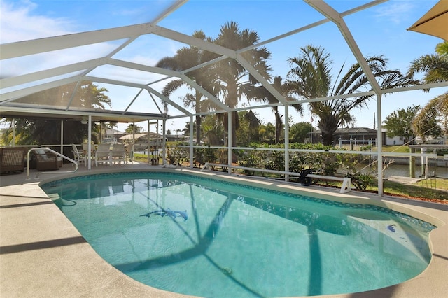 view of swimming pool with glass enclosure