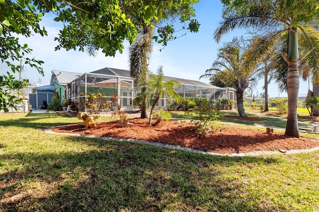 view of yard with glass enclosure