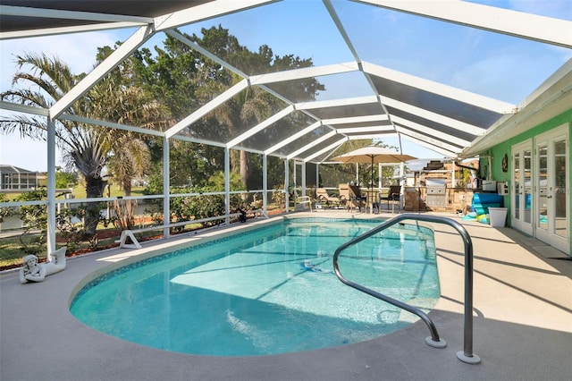 view of pool with a lanai and a patio area