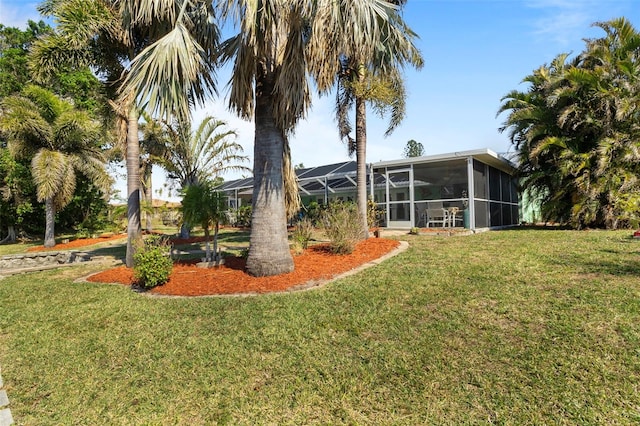 view of yard featuring a sunroom