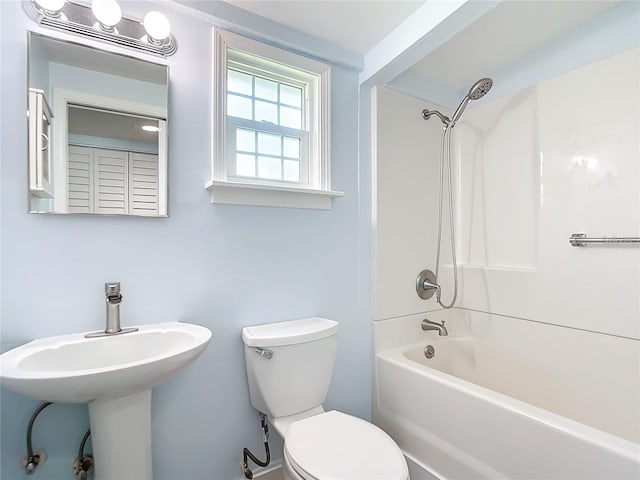 full bathroom featuring  shower combination, sink, and toilet