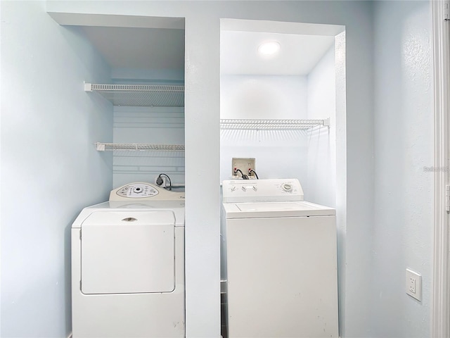 washroom with separate washer and dryer