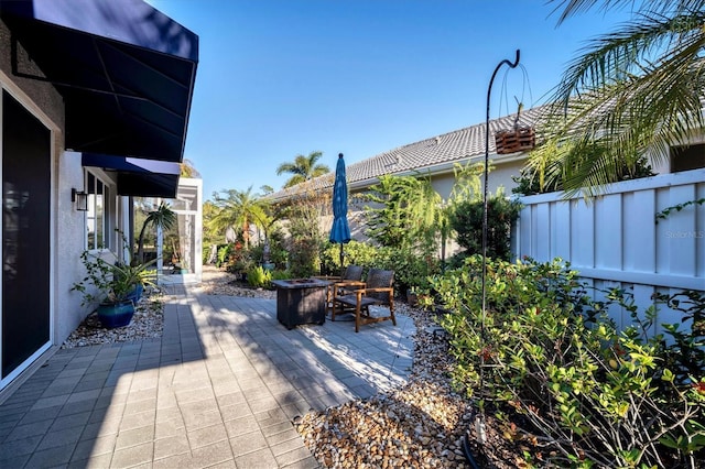 view of patio / terrace with an outdoor fire pit