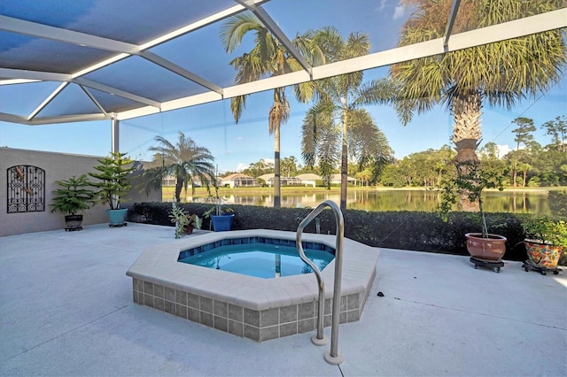 view of pool featuring a water view, an in ground hot tub, a patio, and a lanai