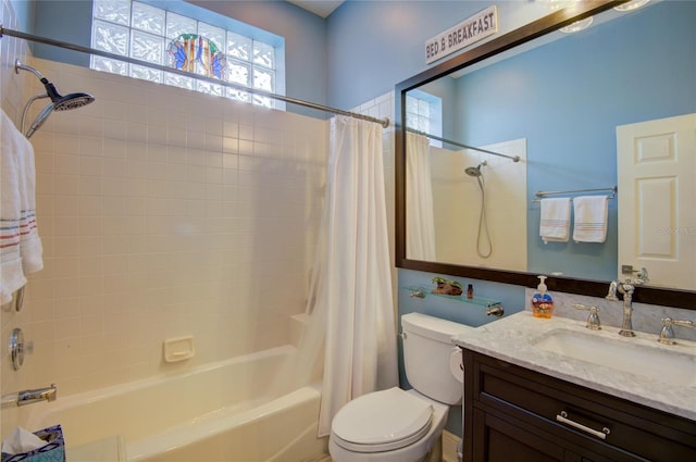 full bathroom with vanity, toilet, and shower / bath combo with shower curtain