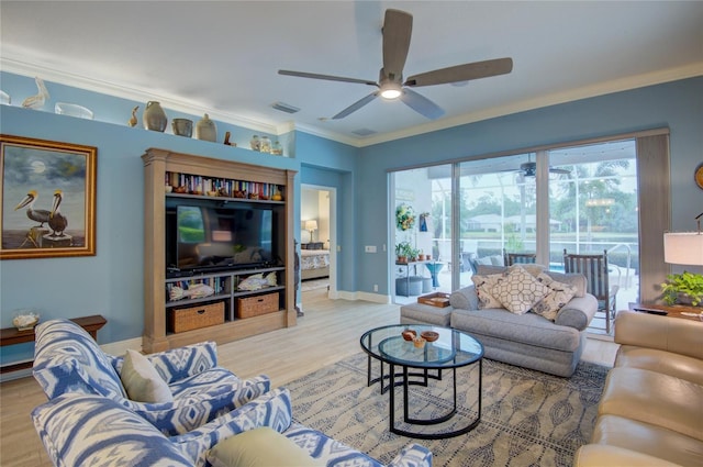 living room with crown molding, ceiling fan, and light wood-type flooring