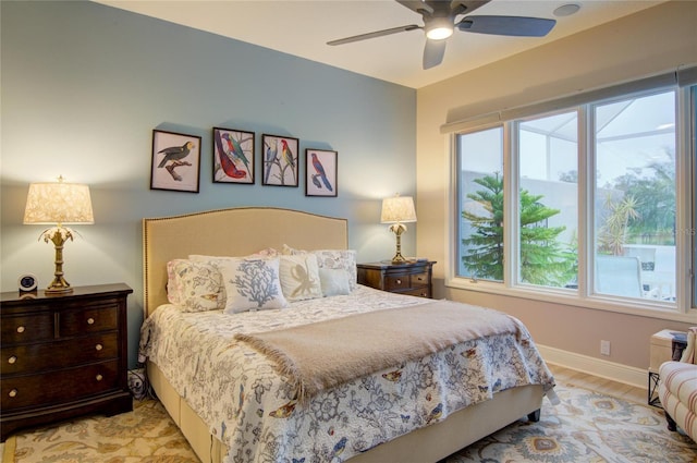 bedroom featuring ceiling fan and light hardwood / wood-style flooring