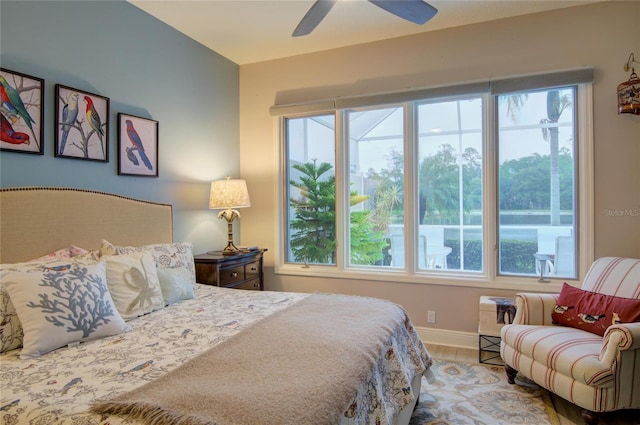 bedroom with wood-type flooring and ceiling fan