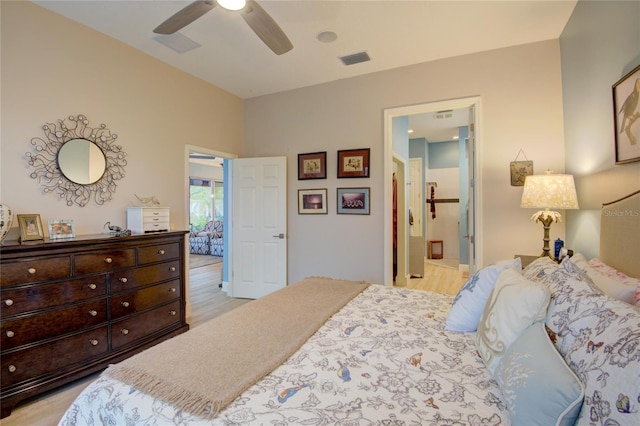 bedroom with connected bathroom, ceiling fan, and light hardwood / wood-style floors