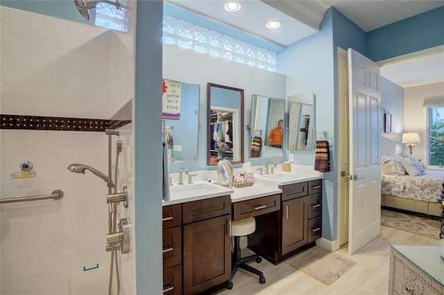 bathroom with vanity and a shower