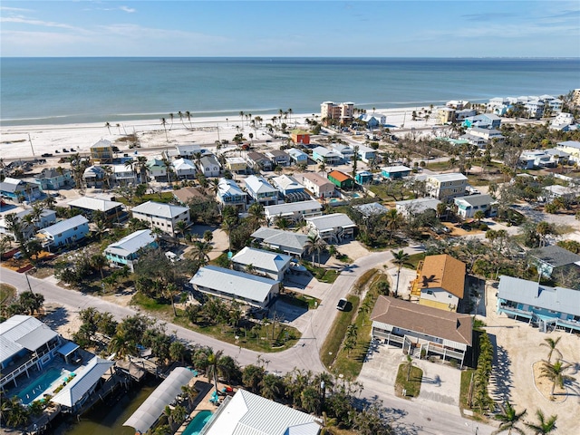 drone / aerial view with a water view and a residential view