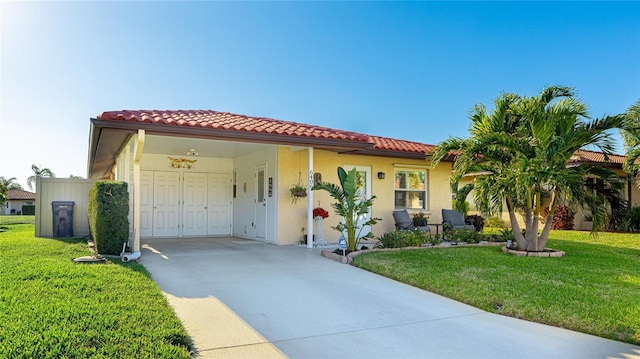 mediterranean / spanish house with a carport and a front yard