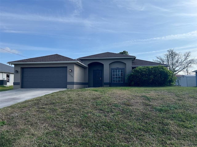 single story home with a garage, central AC unit, and a front lawn