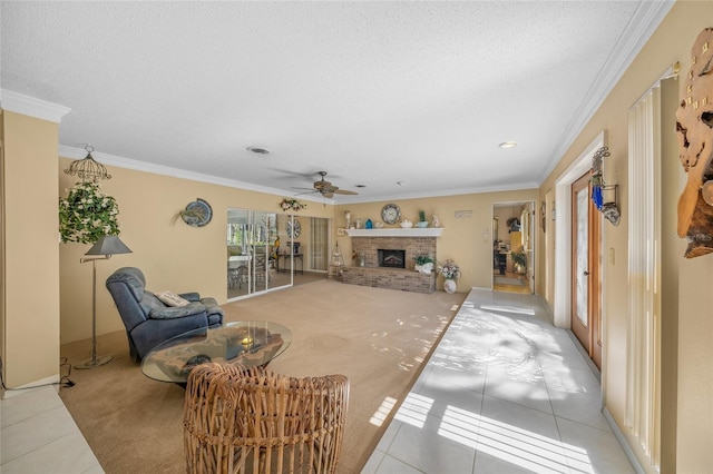 living room featuring crown molding, light tile patterned floors, light colored carpet, a brick fireplace, and a textured ceiling