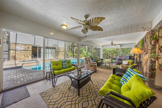 sunroom with a ceiling fan