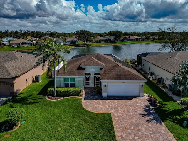 birds eye view of property featuring a water view