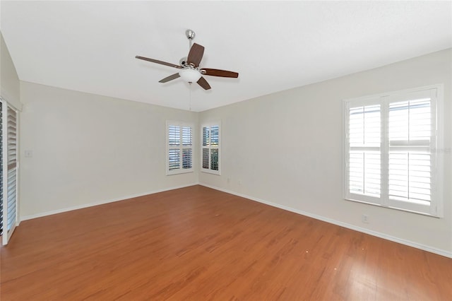 spare room featuring hardwood / wood-style flooring and ceiling fan