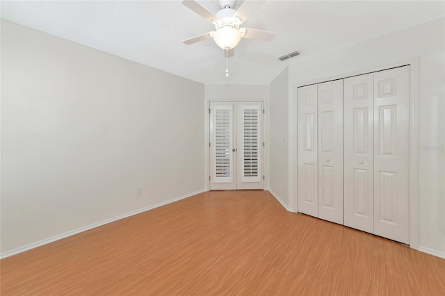 unfurnished bedroom featuring ceiling fan and light wood-type flooring