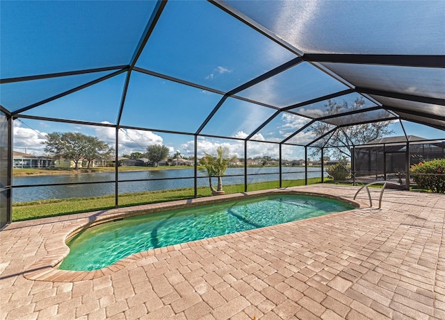 view of pool featuring a water view, a lanai, and a patio area