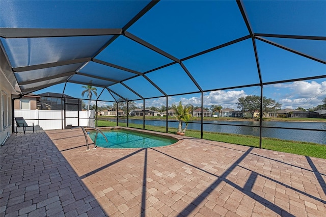 view of pool featuring a water view, a lanai, and a patio area