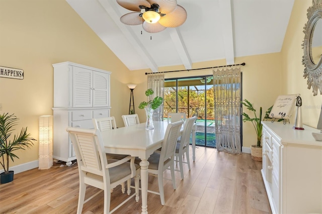 dining space featuring beam ceiling, high vaulted ceiling, ceiling fan, and light wood-type flooring