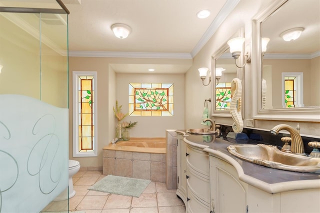 bathroom with crown molding, a relaxing tiled tub, vanity, and toilet