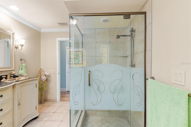 bathroom with vanity, tile patterned floors, a shower with door, and ornamental molding