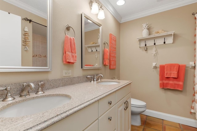 bathroom featuring vanity, tile patterned floors, ornamental molding, and toilet