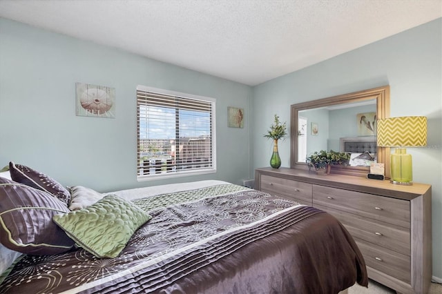 carpeted bedroom with a textured ceiling