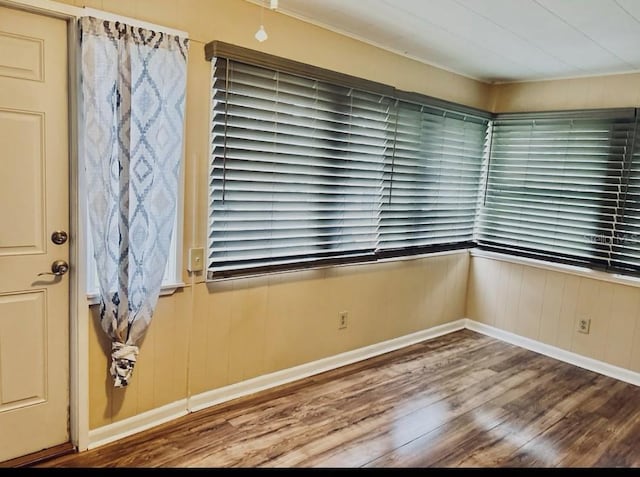 unfurnished room featuring hardwood / wood-style flooring