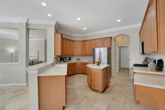 kitchen with sink, ornamental molding, a center island, kitchen peninsula, and stainless steel appliances