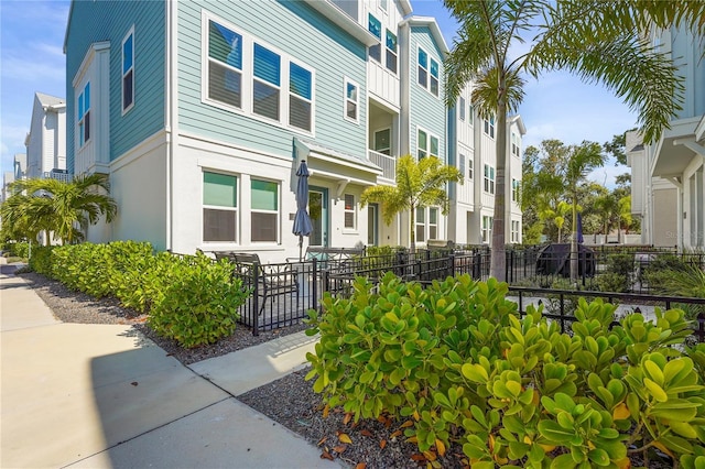 exterior space with a residential view and fence