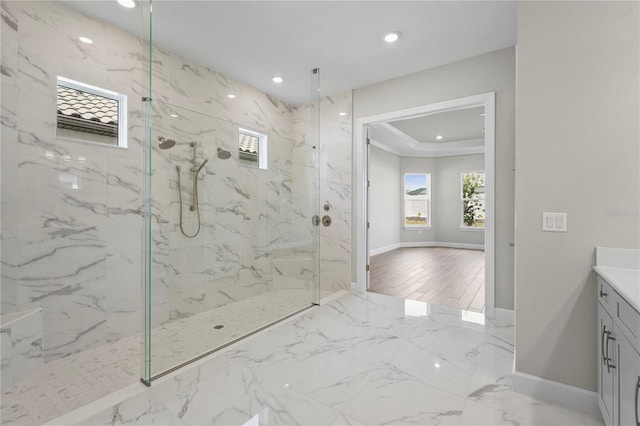 bathroom with marble finish floor, recessed lighting, baseboards, and vanity