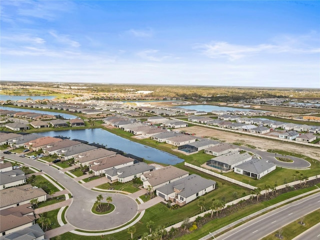 aerial view featuring a water view and a residential view