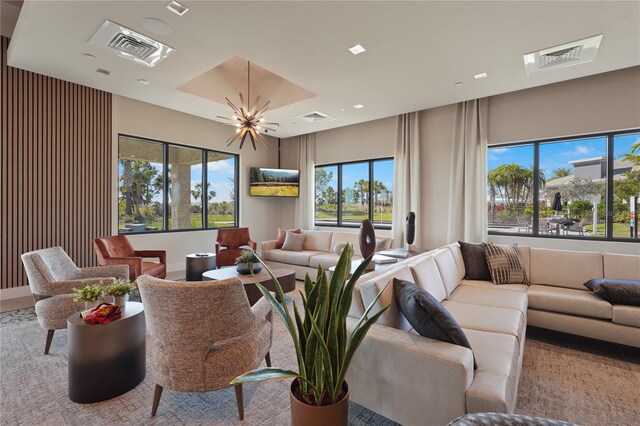 living room with visible vents and a notable chandelier