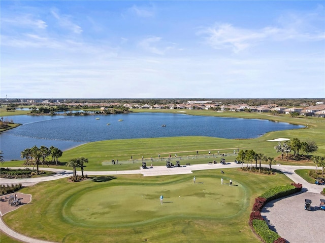 birds eye view of property featuring a water view and golf course view