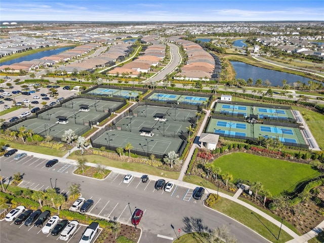 aerial view with a water view and a residential view